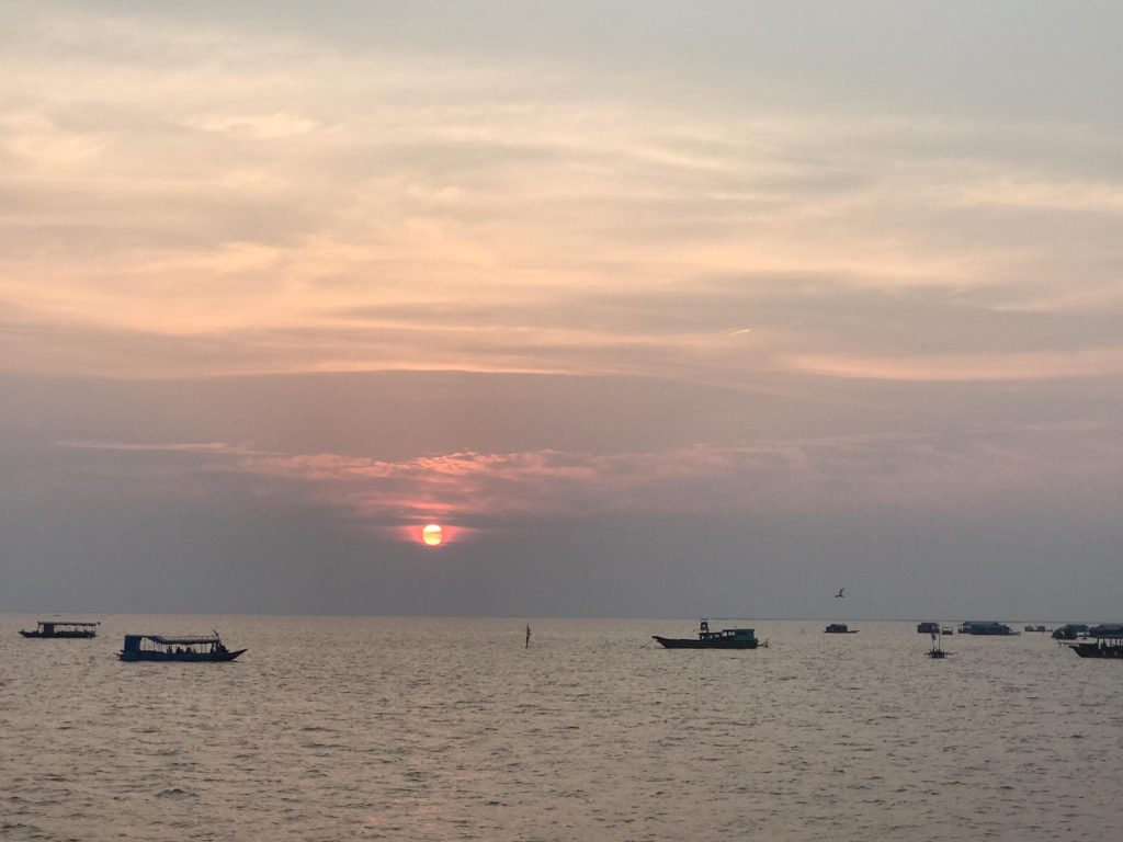 floating villages with small boats on the Tonle Sap Lake