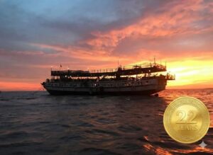 Queen Tara Riverboat at sunset and 22 year gold badge